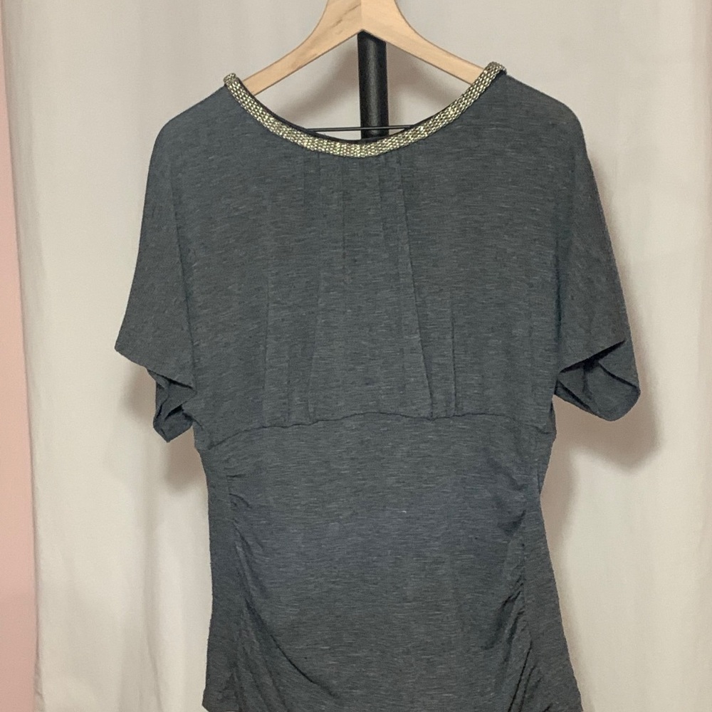 Trendy gray blouse with silver chain neckline.